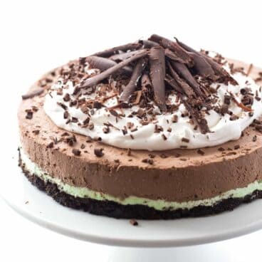 A chocolate cookie crust (baked only 10 minutes!) topped with creamy mint filling and topped with rich, luscious no bake chocolate cheesecake filling! Top it with whipped cream and chocolate curls for an impressive make ahead holiday dessert!