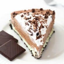 A chocolate cookie crust (baked only 10 minutes!) topped with creamy mint filling and topped with rich, luscious no bake chocolate cheesecake filling! Top it with whipped cream and chocolate curls for an impressive make ahead holiday dessert!