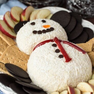 This White Chocolate Toffee Cheese Ball is an easy, no bake dessert that's perfect for any season! Shaped into a snowman, it makes a great addition to a holiday table. Easy to make ahead and freezer friendly!