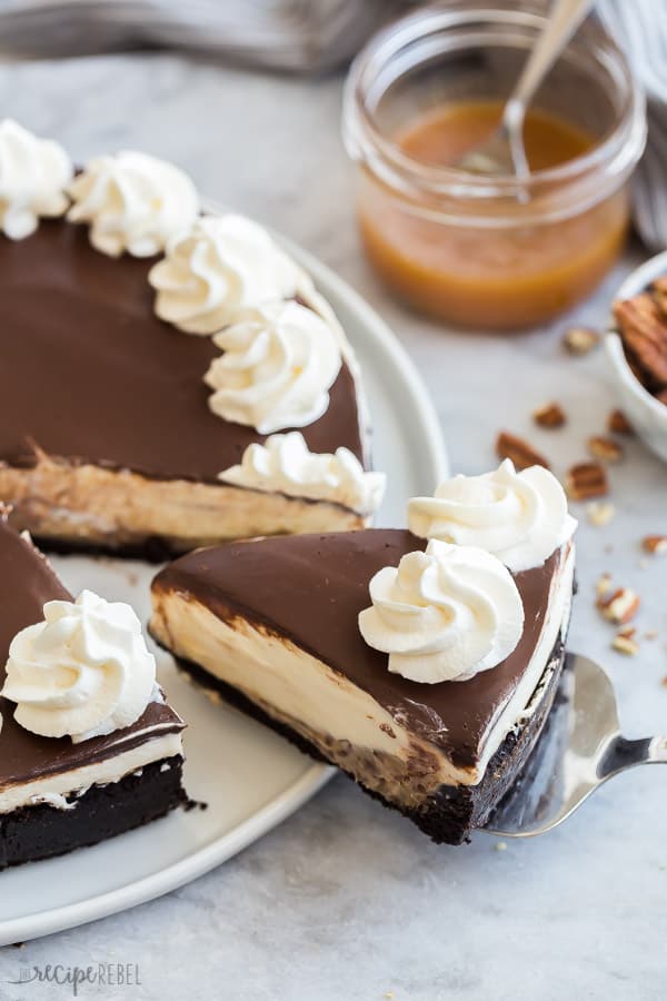 turtle cheesecake slice being pulled out of whole