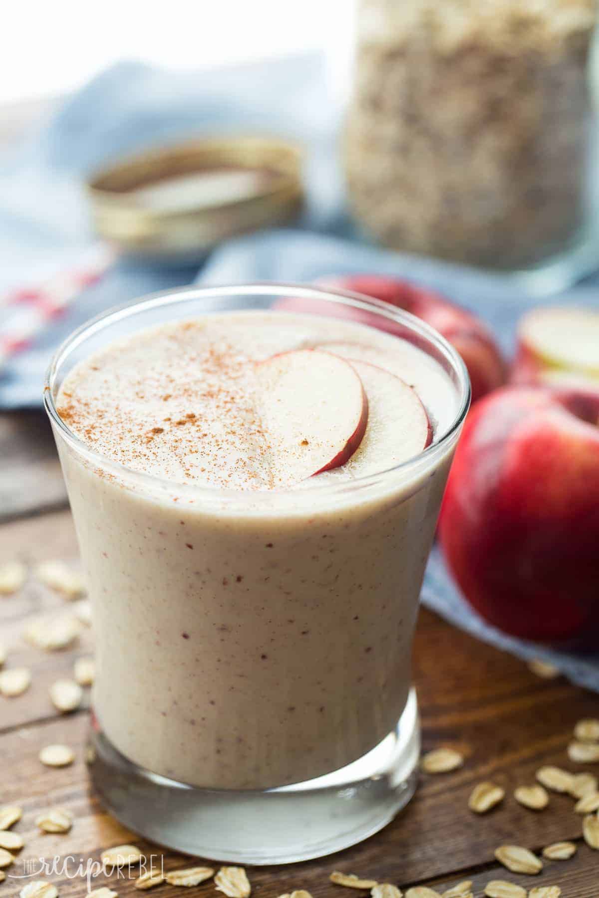 apple crisp smoothie in small glass with apple slices on top