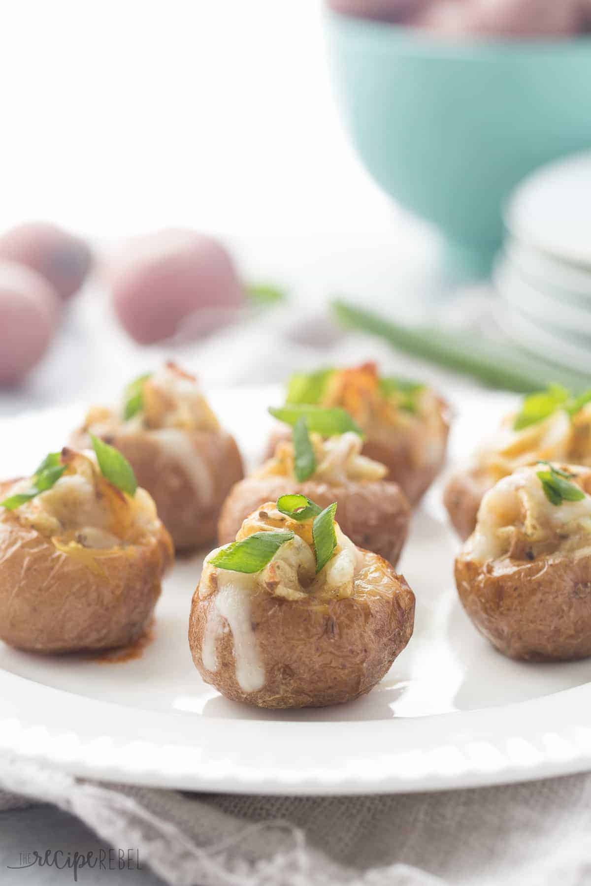 close up image of little twice baked potatoes topped with green onions