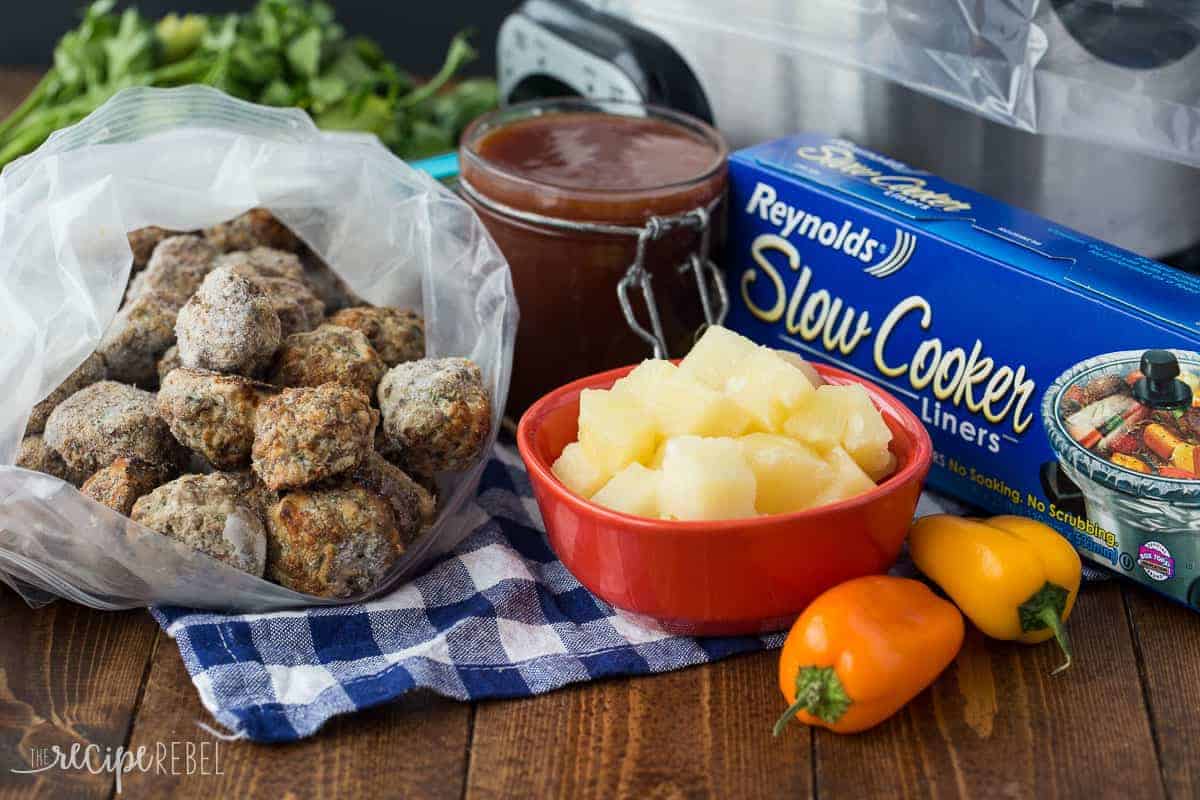 ingredients for pineapple brown sugar meatballs including meatballs pineapple peppers sauce and slow cooker liners