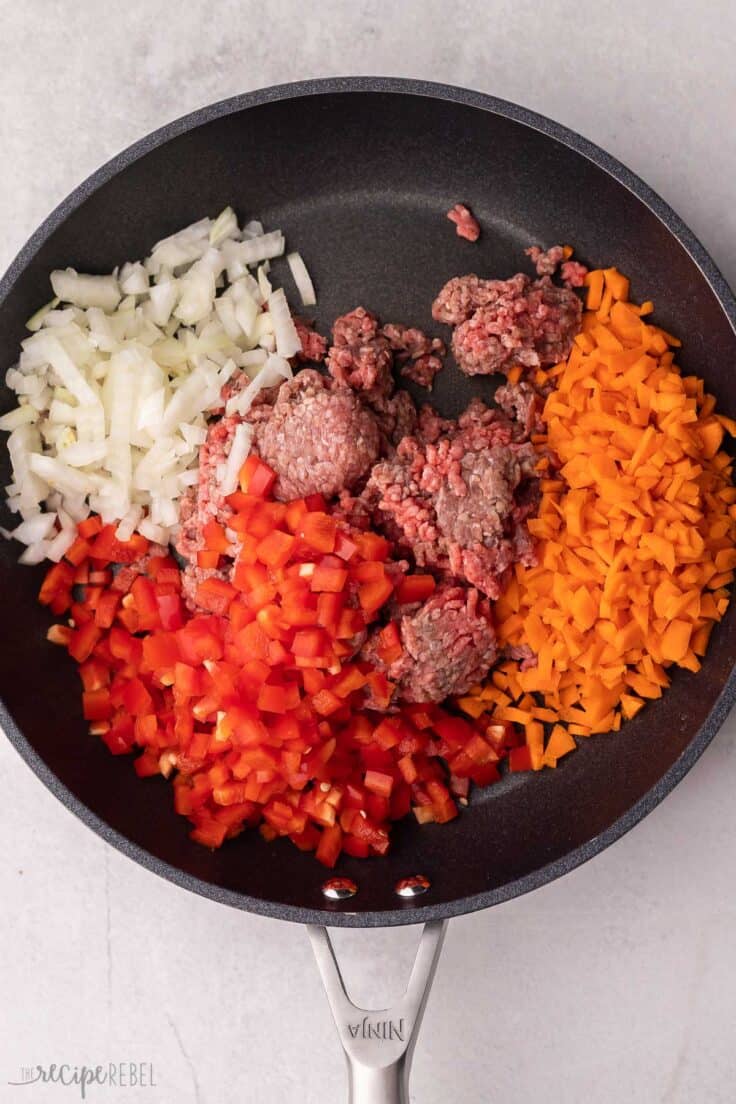 ground beef and vegetables in pan to make chili.