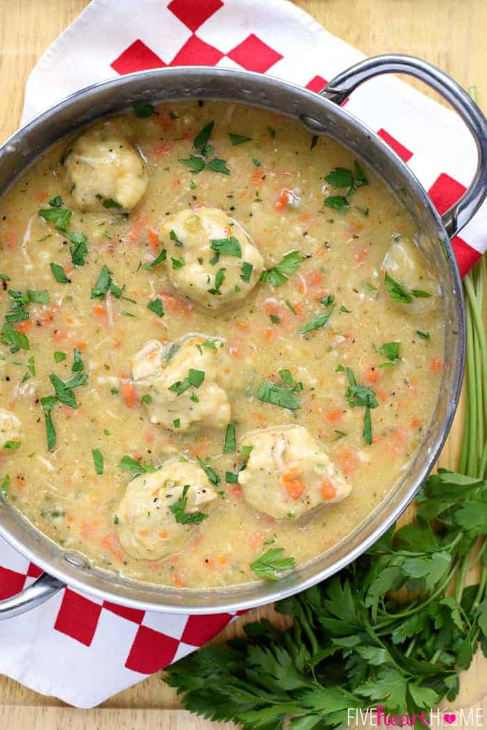 classic chicken and dumplings with fresh parsley sprinkled over