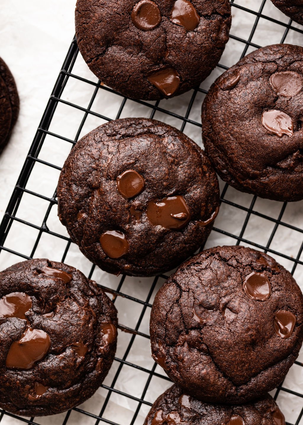 double chocolate cookies on a wire cooling rack.