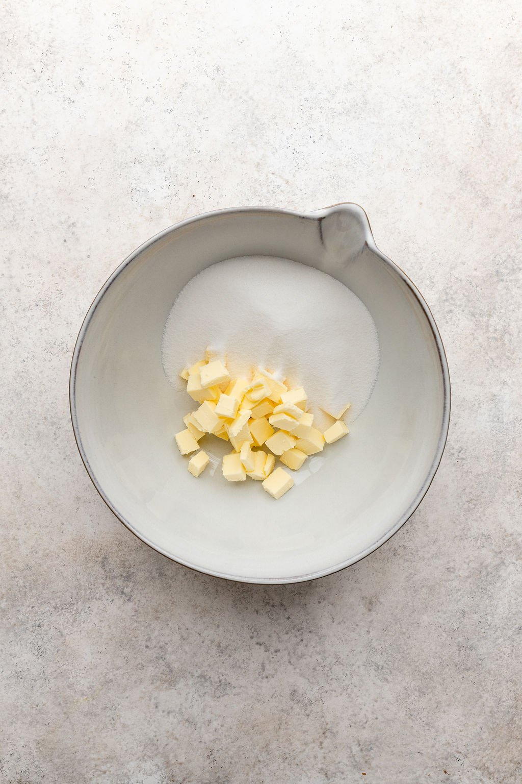 butter and sugar in mixing bowl.