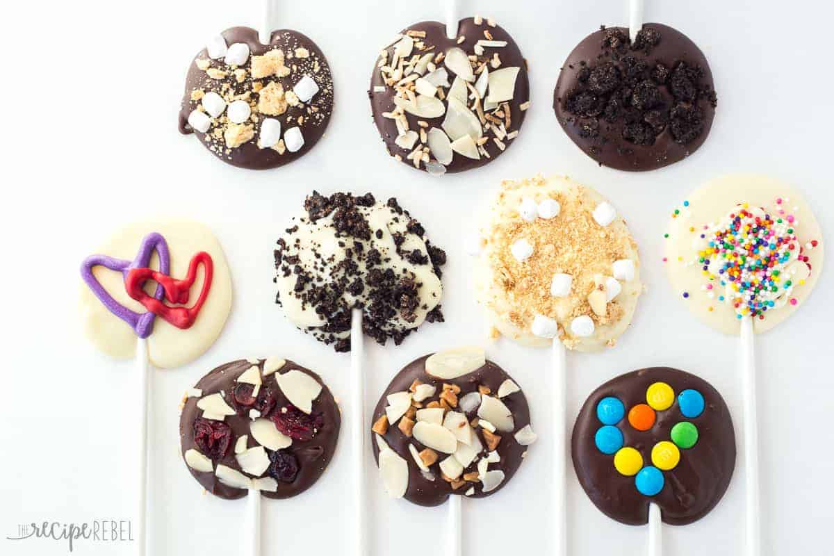 chocolate lollipops lined up with different flavors and toppings