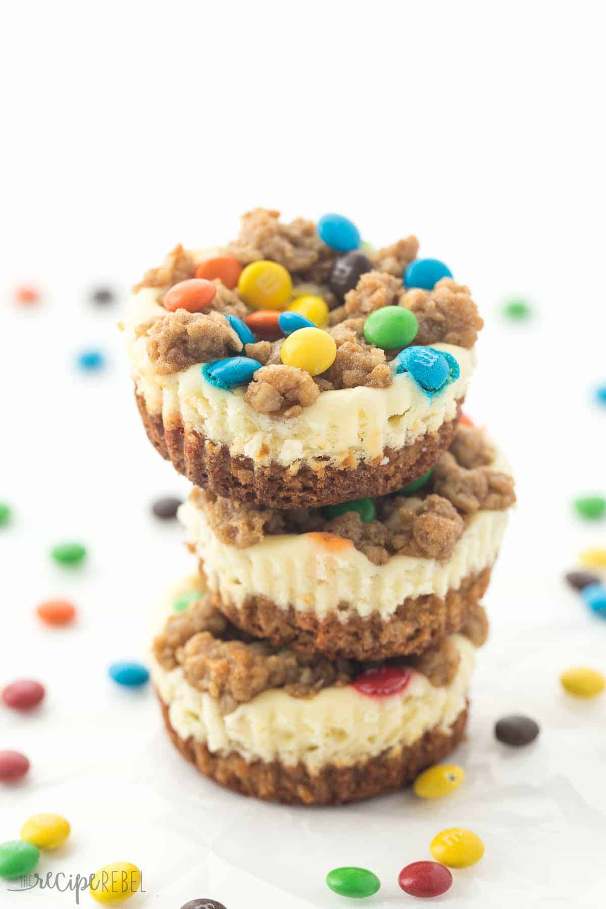 stack of three mini monster cookie cheesecakes with mini M&Ms