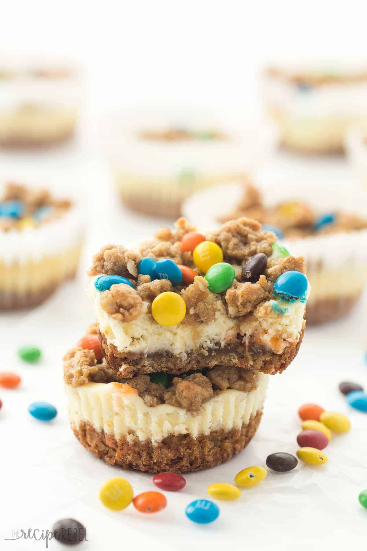 stack of two mini monster cookie cheesecakes with bite out of the top one