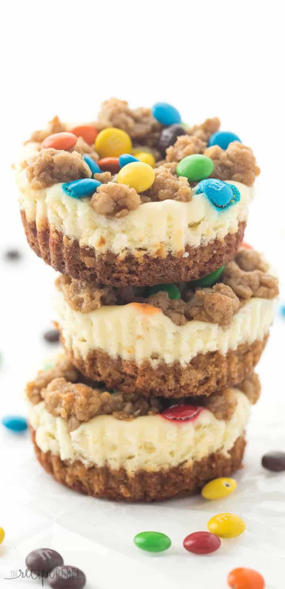 tall image of stacked monster cookie cheesecakes
