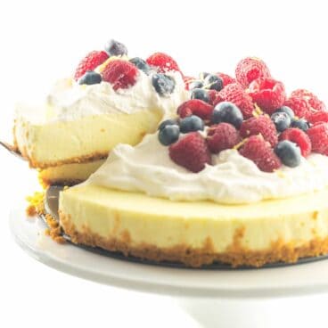 A light, luscious, no bake Lemon Cheesecake with a secret ingredient that makes it even healthier! Top with whipped cream and fresh berries for the perfect Spring or Easter dessert.