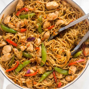 overhead image of chicken chow mein in large white skillet