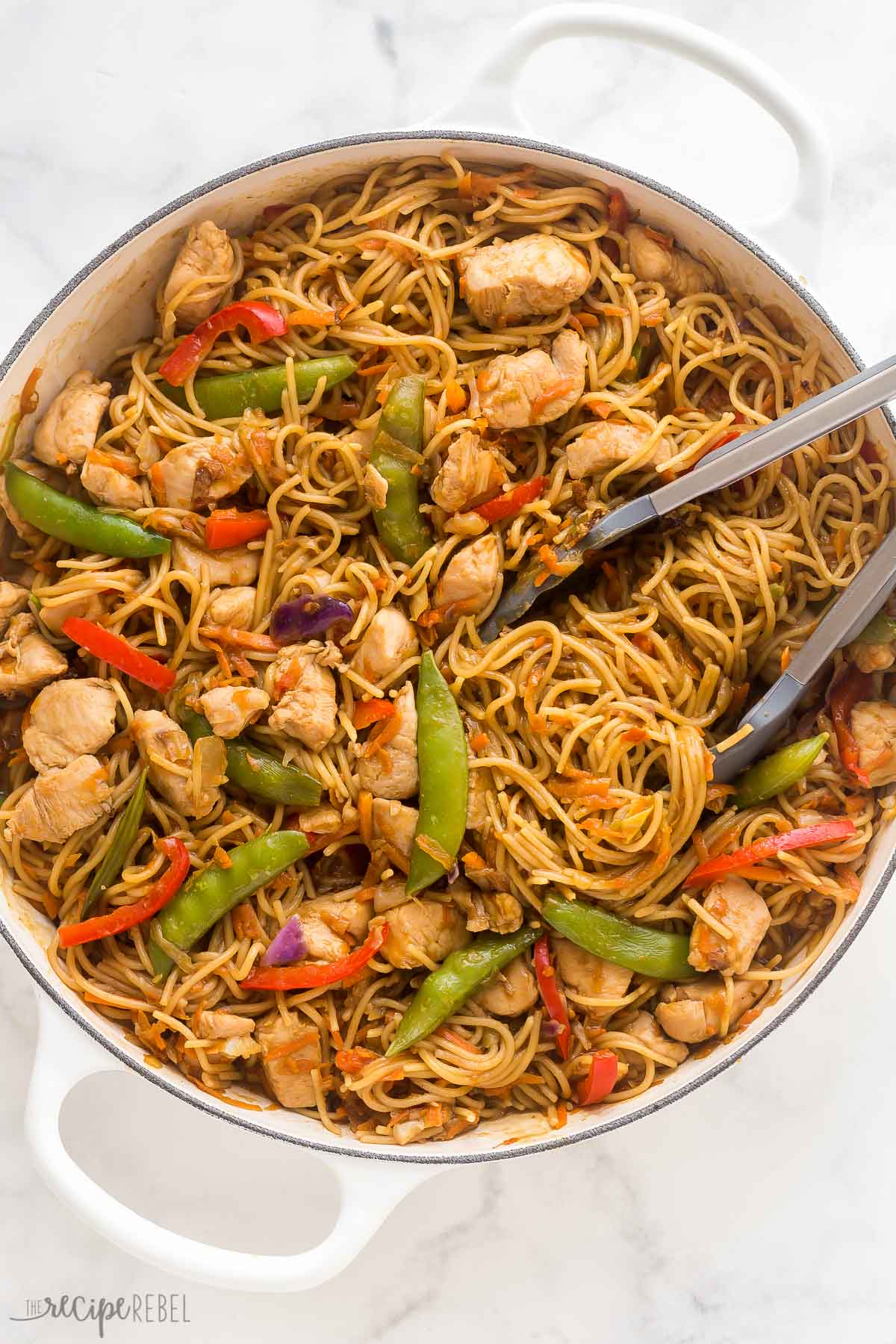 overhead image of chicken chow mein in large white skillet