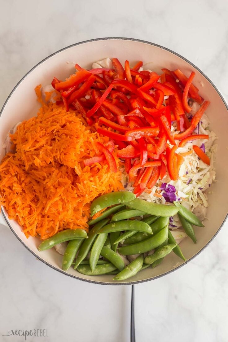 carrots red pepper snap peas and cabbage added to skillet