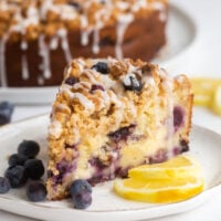 slice of lemon blueberry coffee cake on white plate