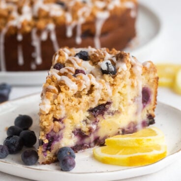 slice of lemon blueberry coffee cake on white plate