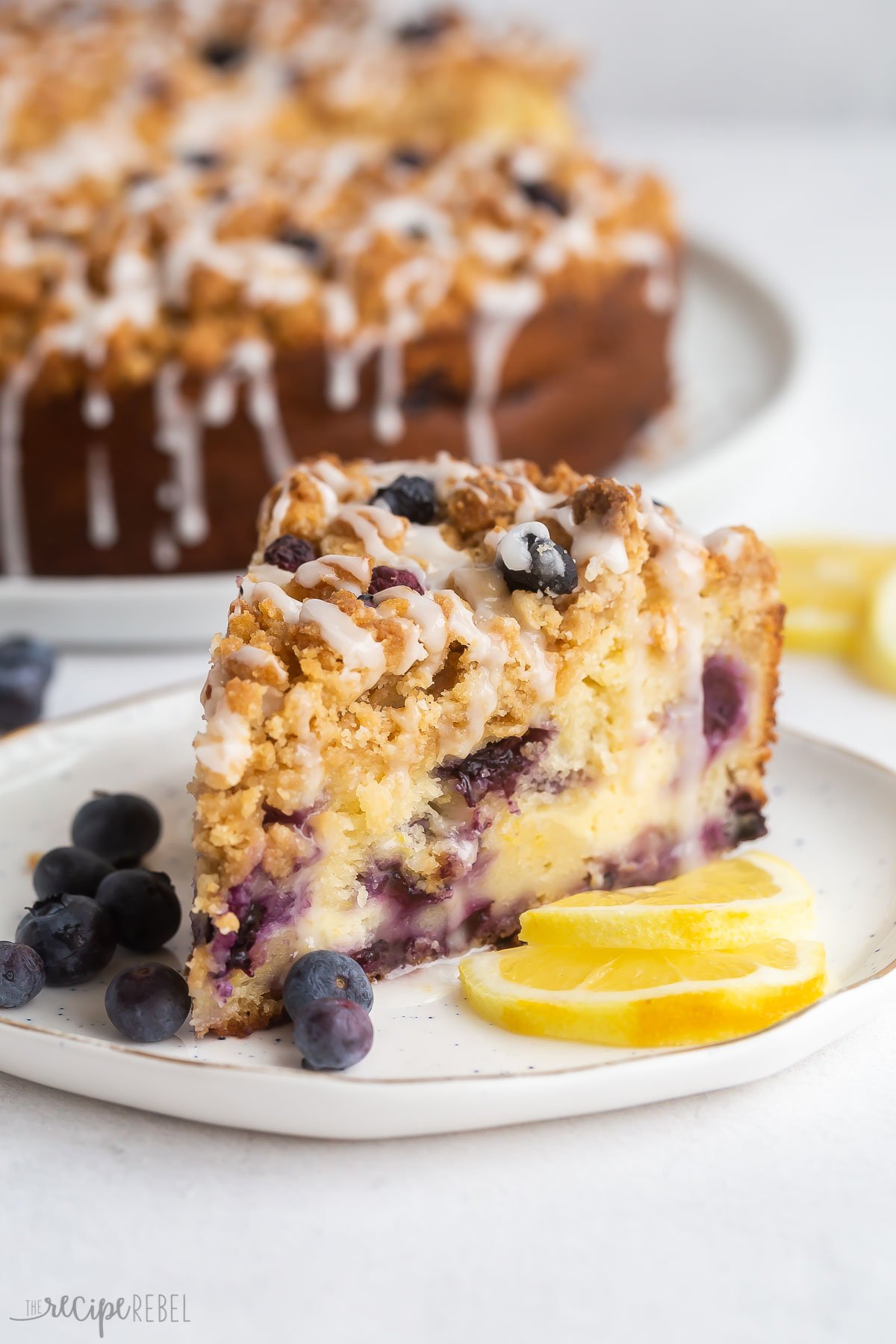 slice of lemon blueberry coffee cake on white plate