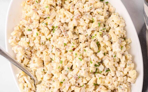 overhead image of potato salad in large white serving bowl