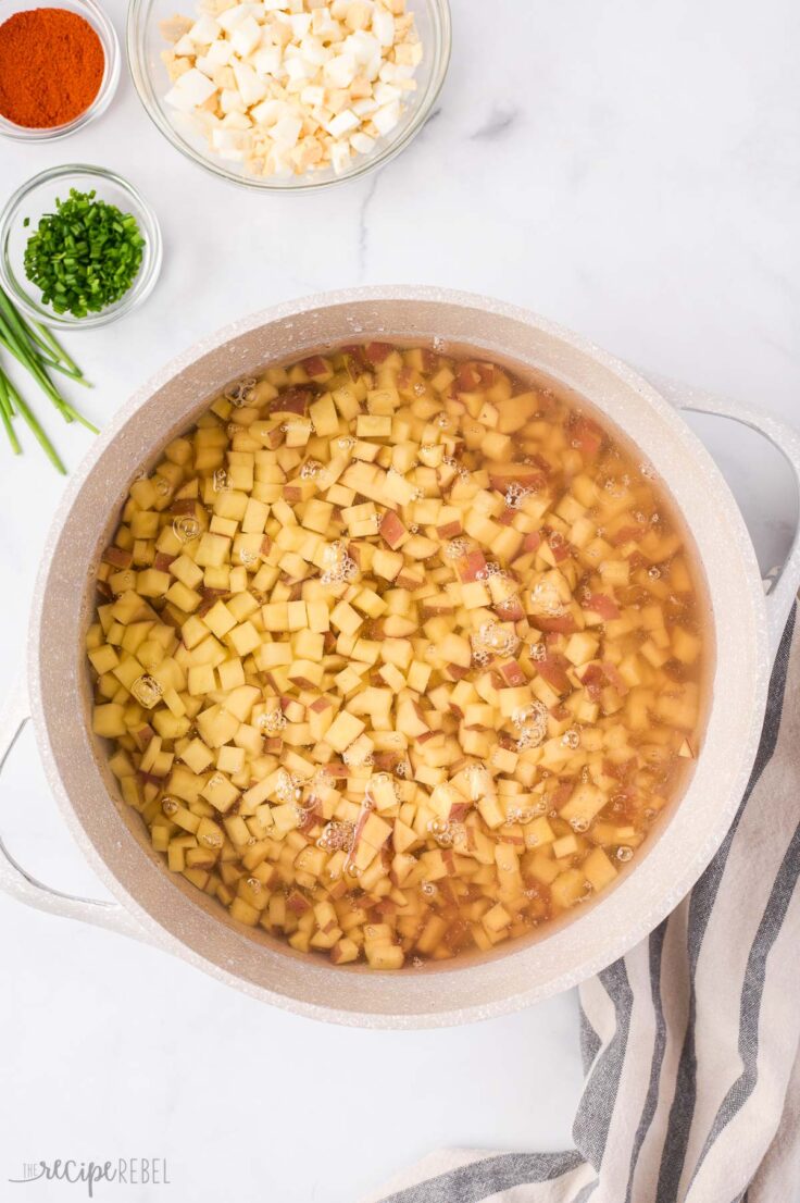 potatoes being cooked to make potato salad