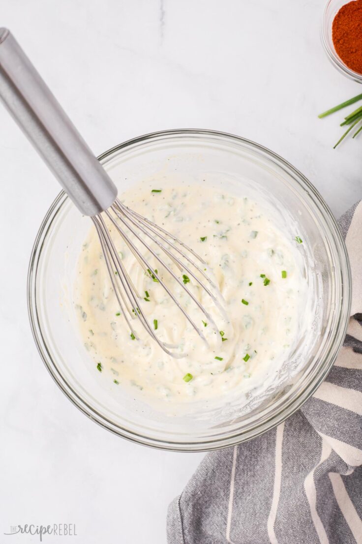 potato salad dressing being stirred together