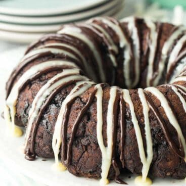 Homemade chocolate biscuit dough (or use store bought) is coated in a chocolate sugar mixture, baked and drizzled with a white chocolate ganache -- this Double Chocolate Monkey Bread is for true chocolate lovers!