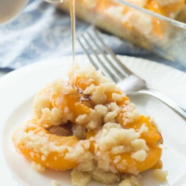 An easy Overnight French Toast Casserole topped with peach cobbler -- the BEST French toast I've ever had! So perfect for Spring!