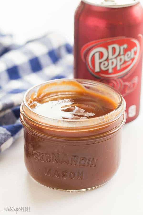 homemade dr pepper bbq sauce in small glass jar in front of can of dr pepper