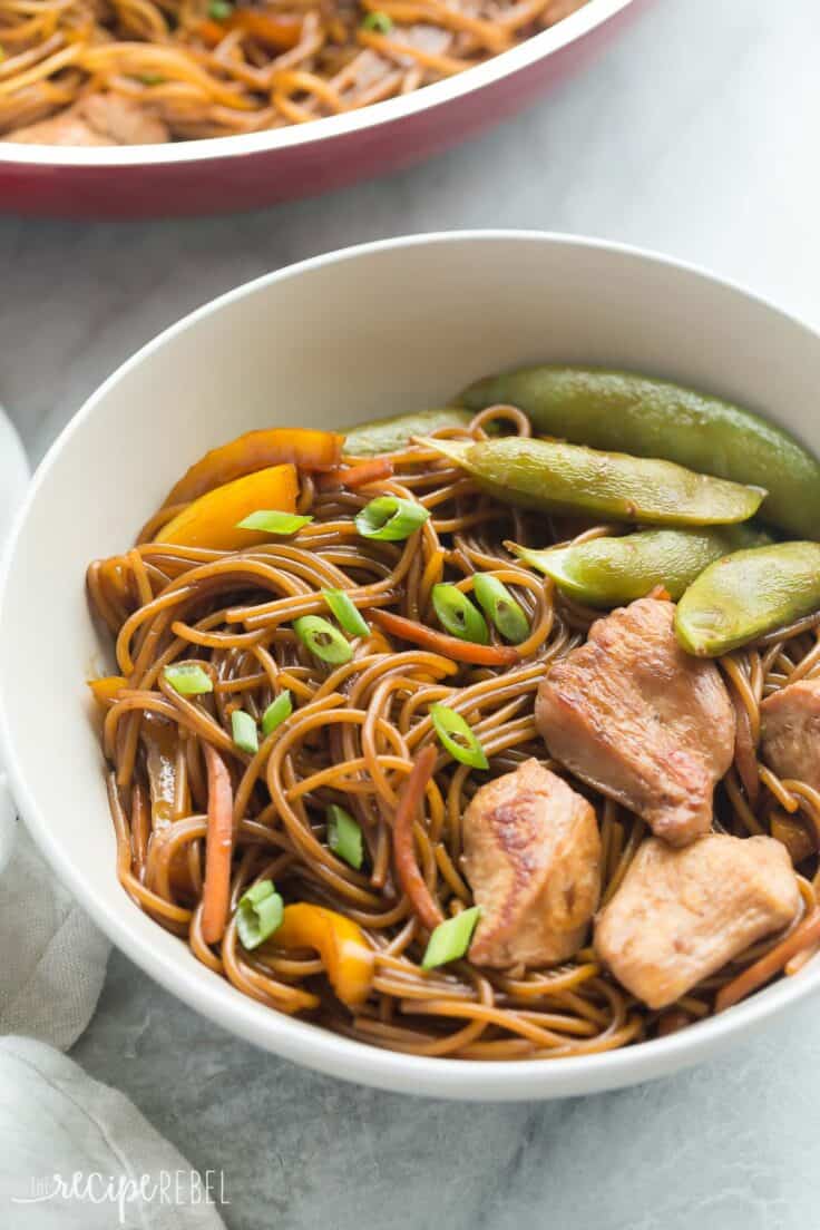 This easy, One Pot Teriyaki Chicken and Noodles is better than any takeout! It's healthier and loaded with veggies, with fewer dishes to wash! PLUS a step by step video! https://www.thereciperebel.com/one-pot-teriyaki-chicken-and-noodles/ one pan teriyaki chicken and noodles in white bowl with peppers and snap peas