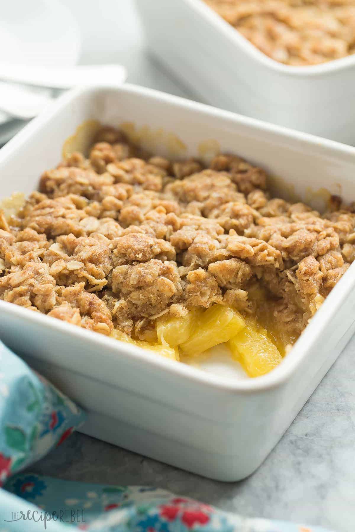 pineapple crisp in white square baking dish close up