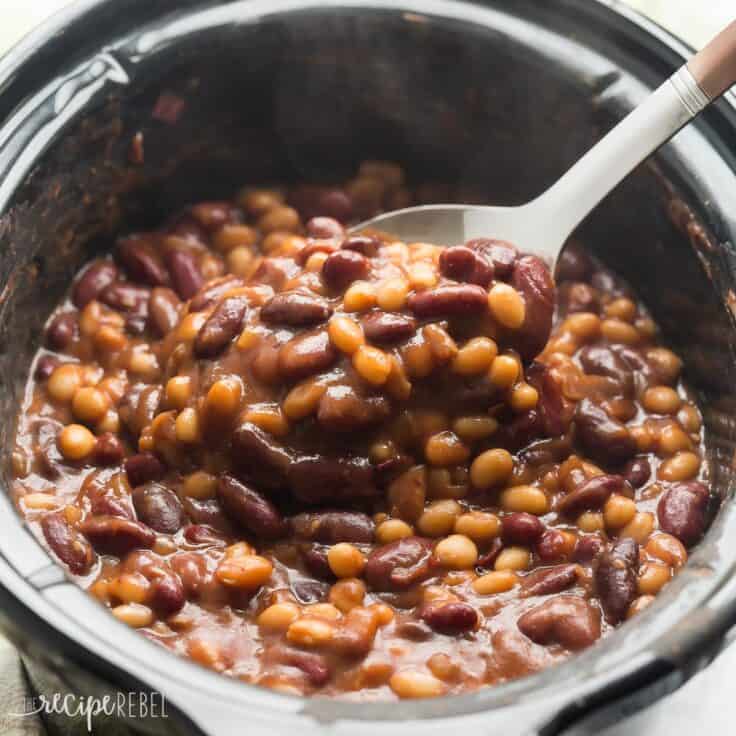 healthier slow cooker maple balsamic baked beans in black crockpot