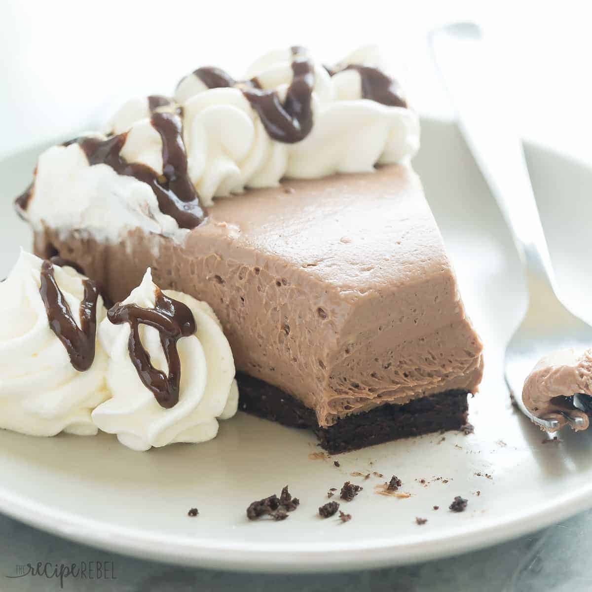 slice of brownie batter cheesecake up close with bite taken from end