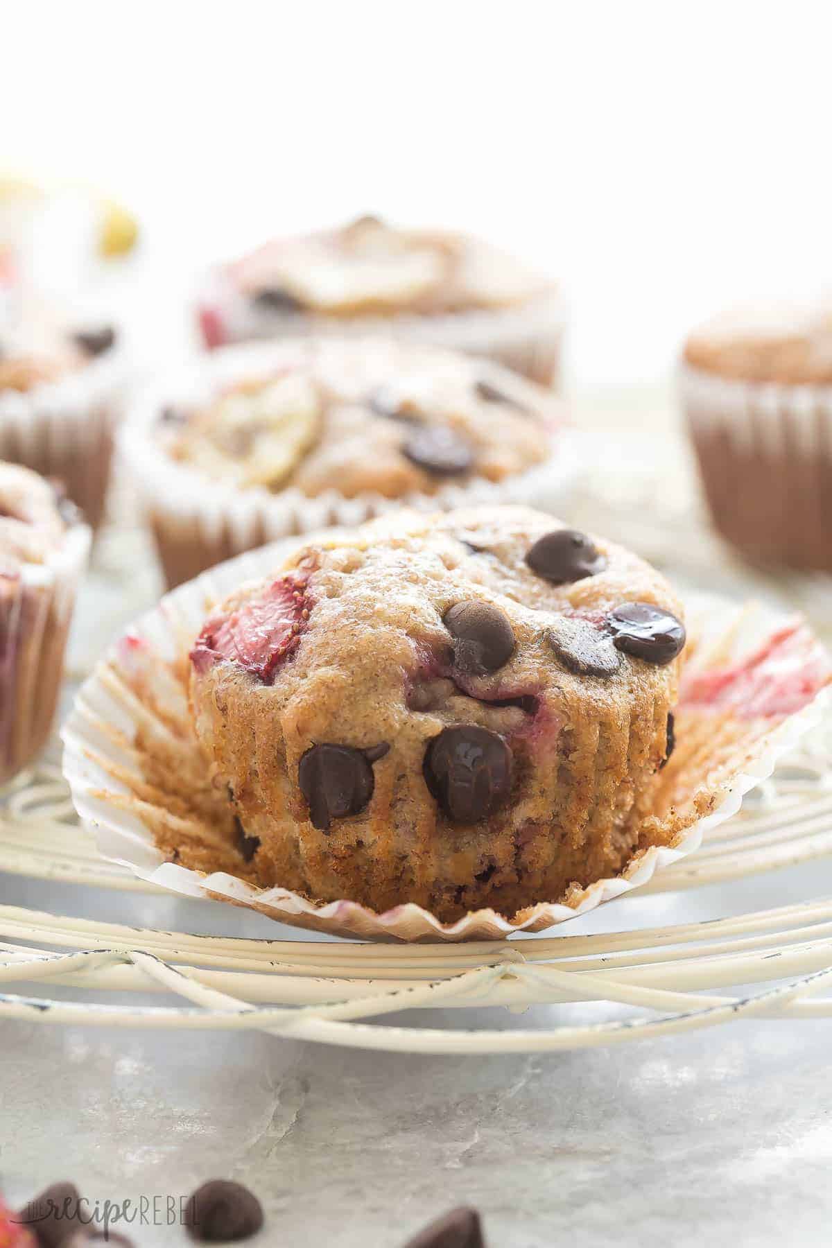 strawberry banana chocolate chip muffin up close unwrapped on white cooling rack