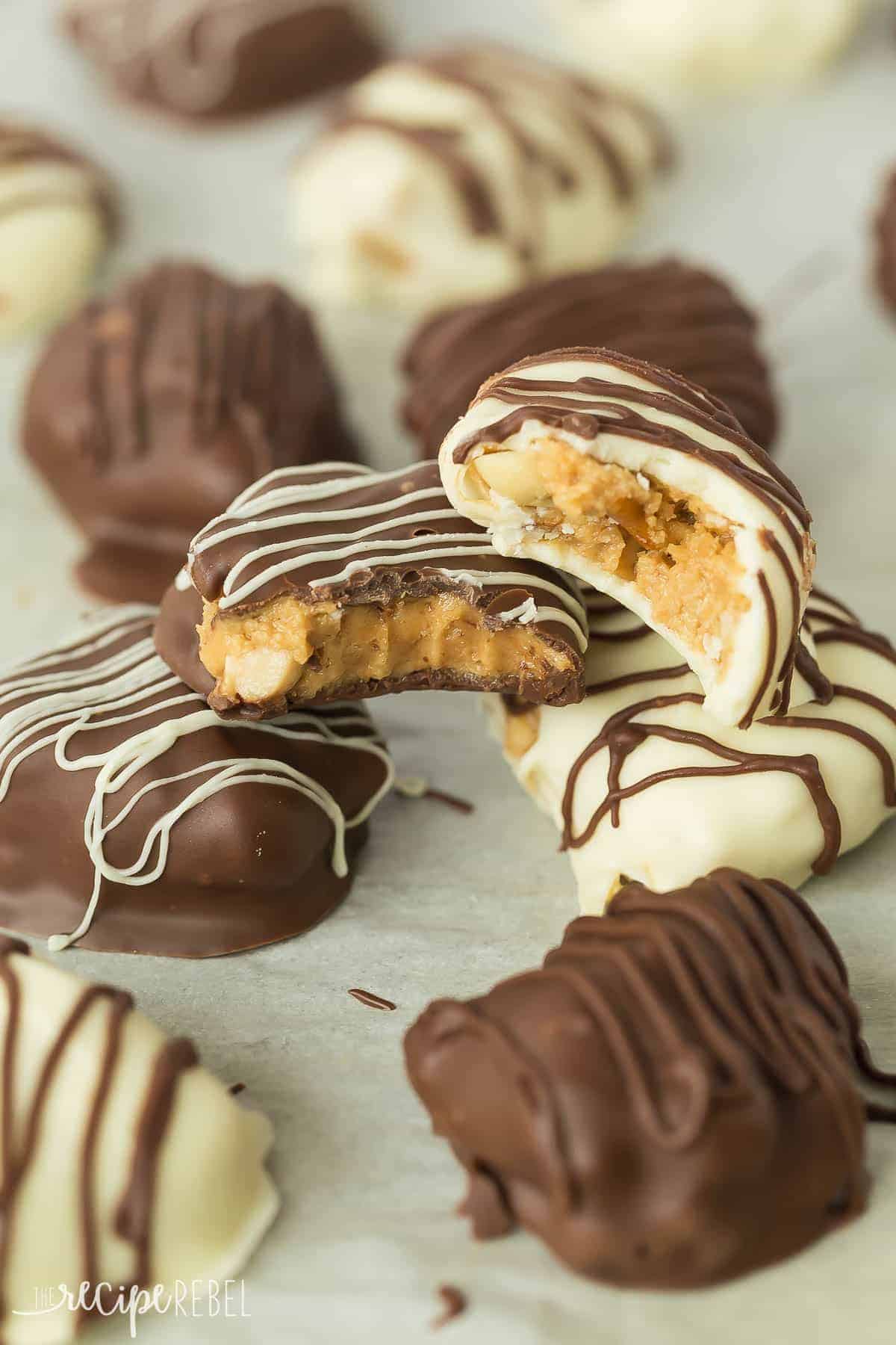dark chocolate and white chocolate covered candies with a bite taken out of each