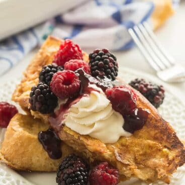 This Baked Lemon French Toast is so much easier than flipping French toast on the stove! It's perfect for holiday gatherings, brunch potlucks, and Christmas gatherings! Top with fresh berries and whipped cream or yogurt for a special morning treat.