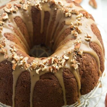 This Praline-Glazed Apple Bundt Cake is SO moist and loaded with apples and pecans, then smothered in a praline glaze -- a great fall dessert, perfect for Thanksgiving or Christmas!