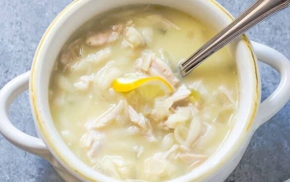 slow cooker lemon chicken soup in white bowl