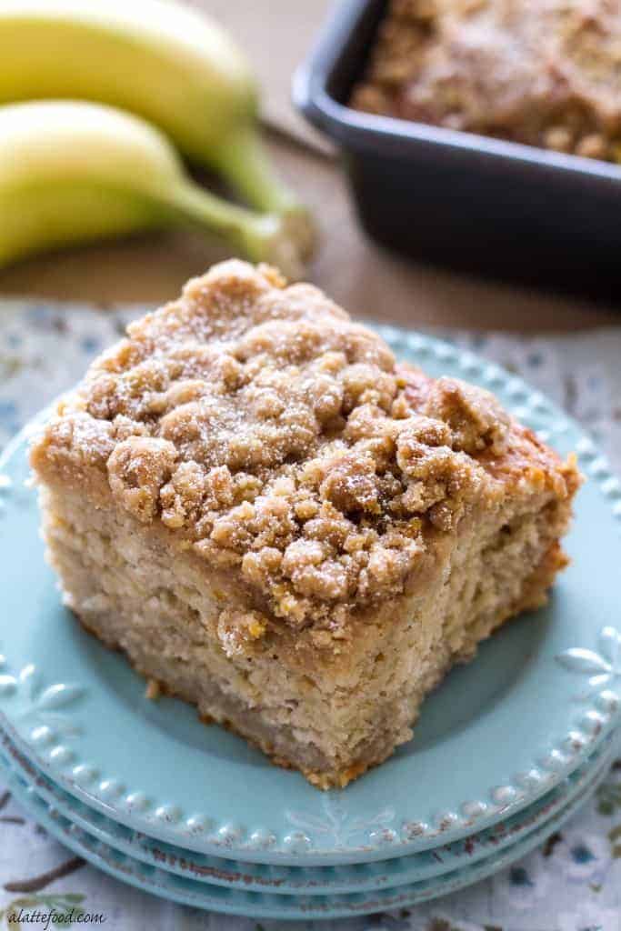 skinny honey banana coffee cake piece on stack of three blue plates