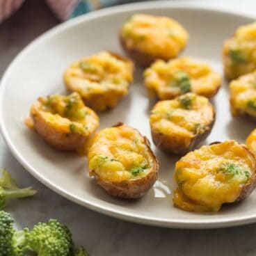 These Broccoli Cheddar Twice Baked Potatoes are bite-sized and make the perfect easy holiday appetizer! Plus, they're easy to make ahead!