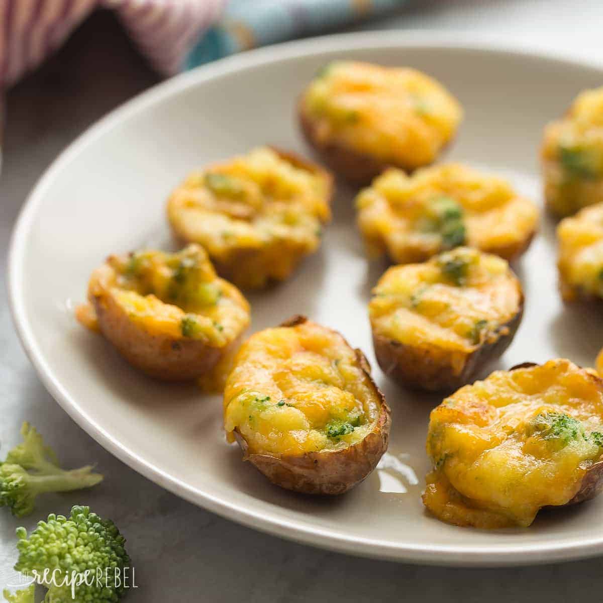 square image of broccoli cheddar twice baked potatoes on grey plate