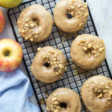 These Apple Cinnamon Baked Donuts are packed with apples (healthy, right?!) and cinnamon -- the perfect fall treat! Smothered in a brown sugar glaze that makes these a decadent dessert or special breakfast :)