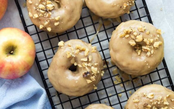 These Apple Cinnamon Baked Donuts are packed with apples (healthy, right?!) and cinnamon -- the perfect fall treat! Smothered in a brown sugar glaze that makes these a decadent dessert or special breakfast :)