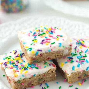 This recipe for Frosted Funfetti Blondies is a KEEPER! They are dense and fudgy and loaded with sprinkles, then topped with a creamy buttercream frosting -- perfect for birthdays or parties!