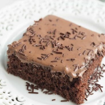 These Frosted Texas Brownies are made with a whisk and a bowl -- no mixer required! They make a huge sheet pan and are perfect for potlucks!