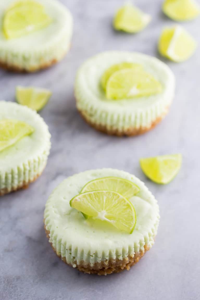 mini key lime greek yogurt cheesecakes with fresh lime slices