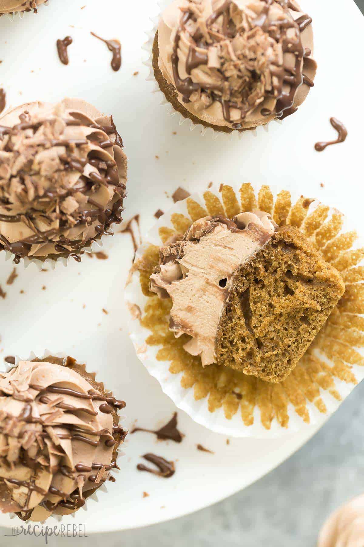 one mocha nutella cupcake unwrapped and cut in half laying on its side