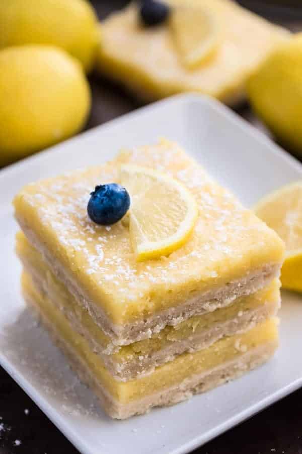 the best skinny lemon bars stack of 3 on white plate