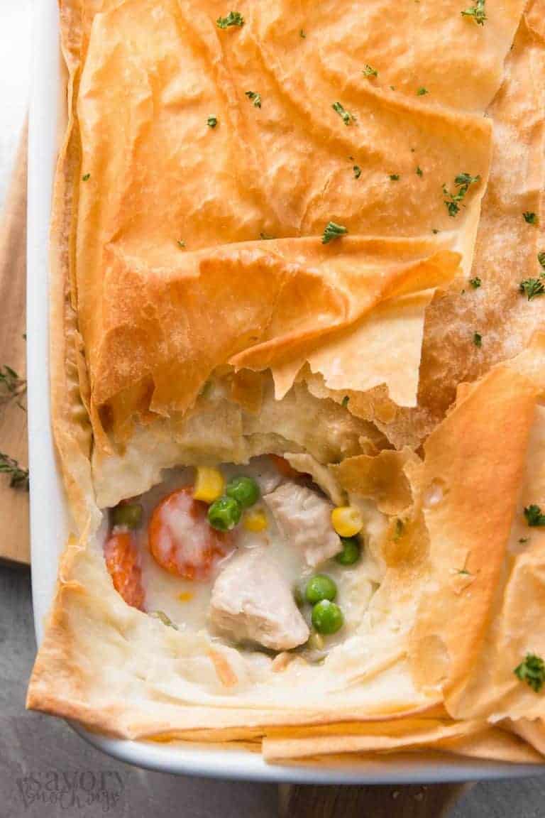 healthy turkey pot pie with top cut out to reveal turkey and vegetables