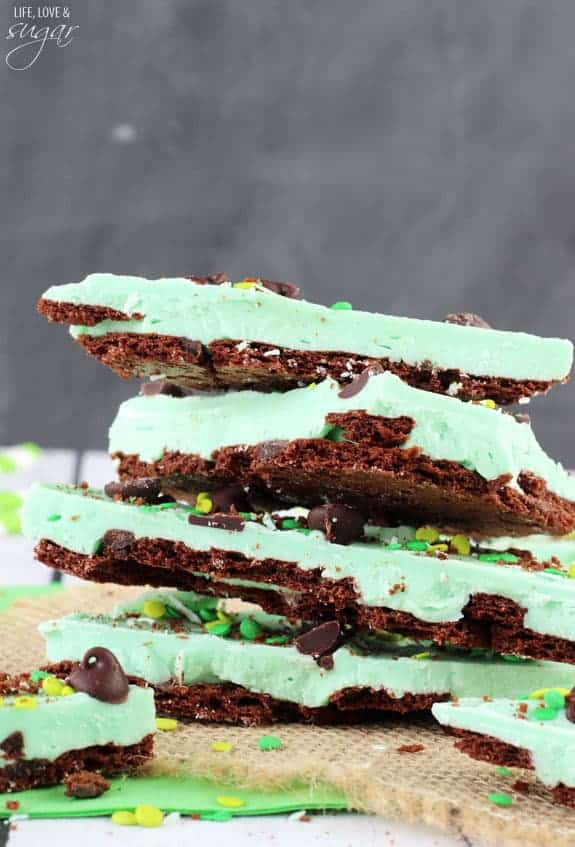 mint chocolate brownie brittle bark stack of 4 large pieces on grey background