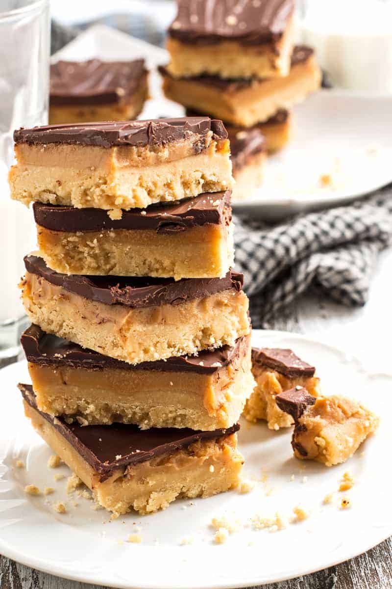 no bake millionaire bars stack with caramel and chocolate layers